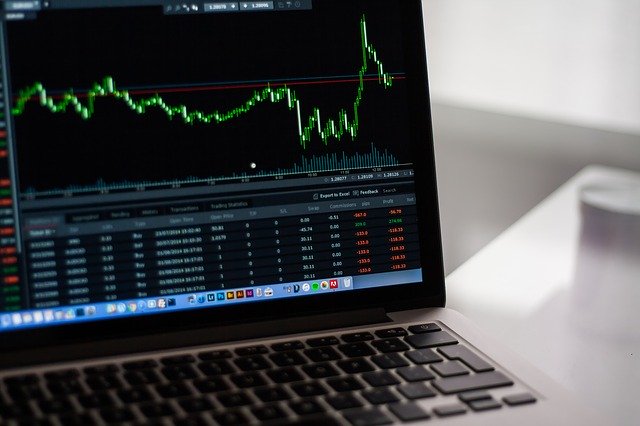 computer screen showing ups and downs of the stock market