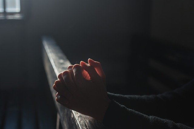 individual praying in church