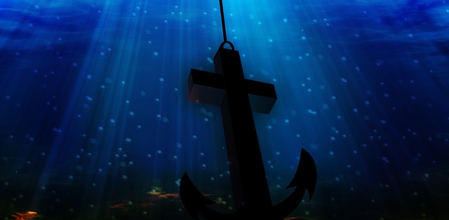 cross anchor deep in water.