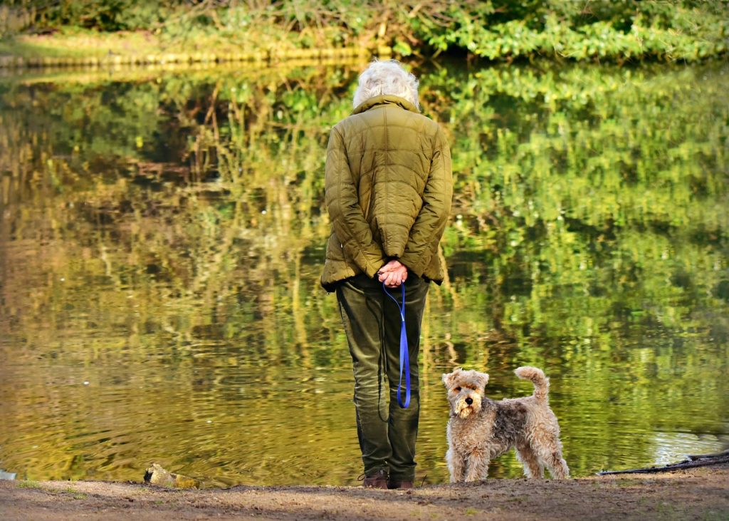 woman standing by pond